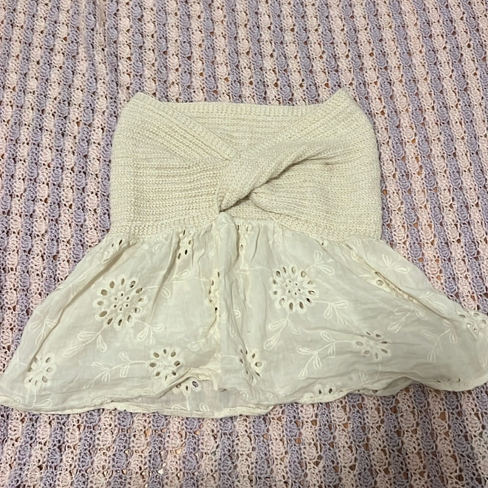 Knit sleeveless top with knot and eyelet